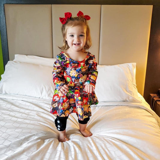 Superhero Long Sleeve Scoop Back Peplum Tunic